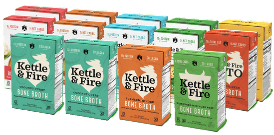 Fourteen Kettle & Fire bone broth cartons in assorted flavors arranged in a row.